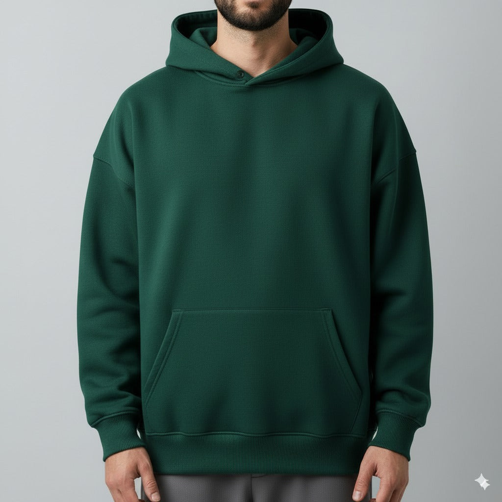Green hoodie worn by a person on a gray background